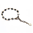 Pulsera Luma de mini cruces met&aacute;licas color plata ajustable