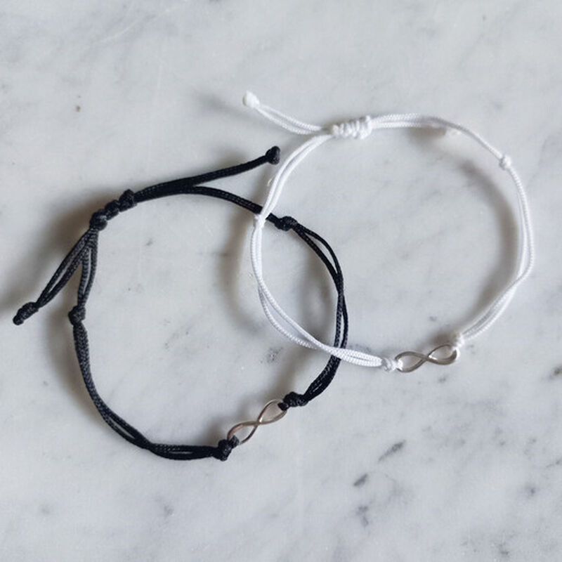Set 2 pulseras infinito de plata con hilo blanc... image number null