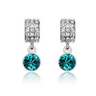 Aretes en Baño de Oro Blanco de 18K con Cristales en Color Blanco Y Azul Turquesa