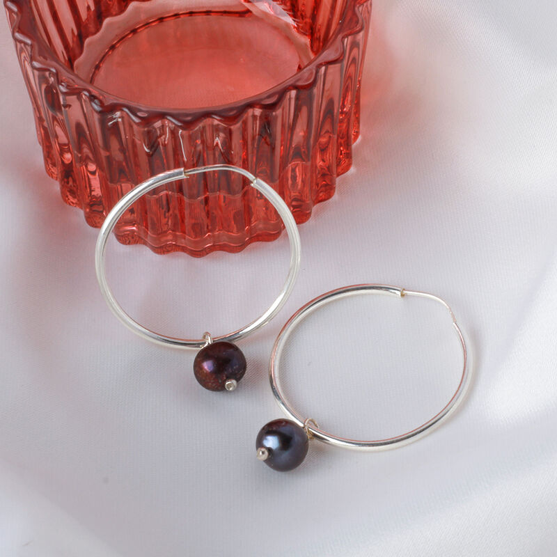 Arracadas de plata con perla negra image number null