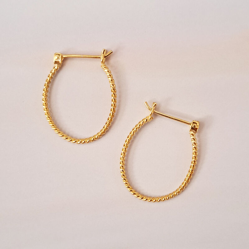 Arracadas Bejuco ovaladas de plata con ba&ntilde;o de ... image number null