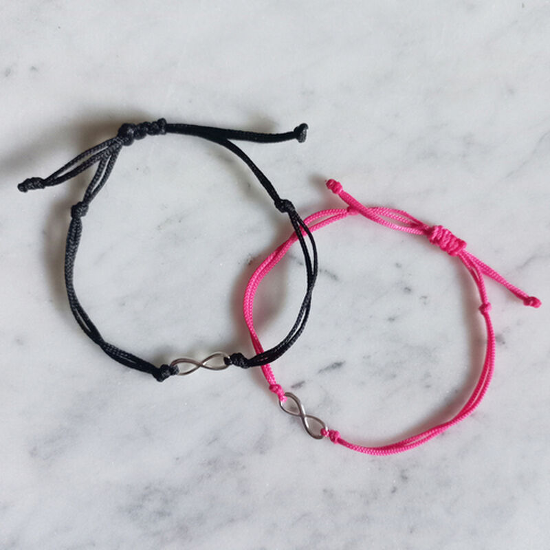 Set 2 pulseras infinito de plata con hilo negro... image number null