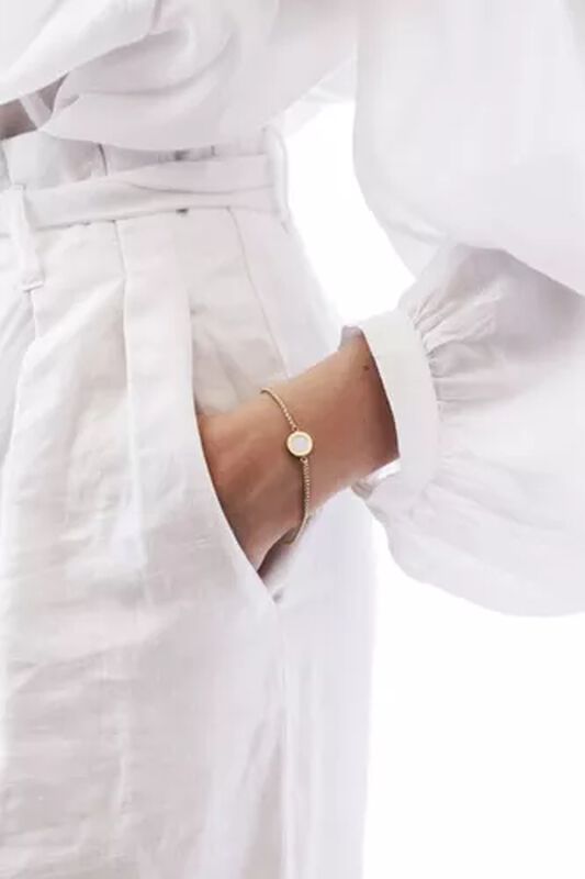 PULSERA OCEAN CADENA CHAPADA EN ORO Y CHARM BLA... image number null